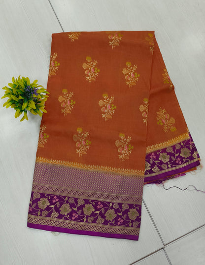 Mango silk designer saree in Rustie orange with contrast floral border and pallu and blouse
