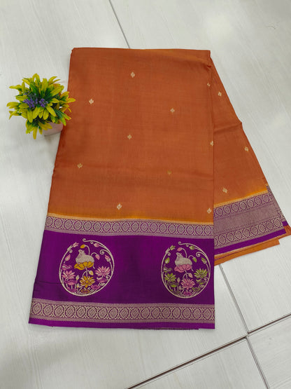 Mango silk designer saree in Rustie orange with contrast pichwai border and pallu and blouse