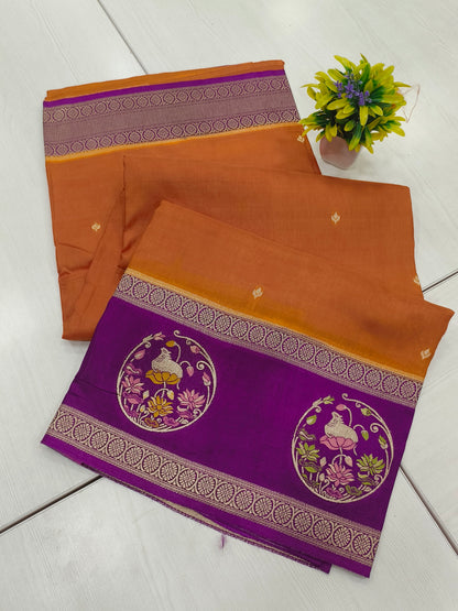Mango silk designer saree in Rustie orange with contrast pichwai border and pallu and blouse