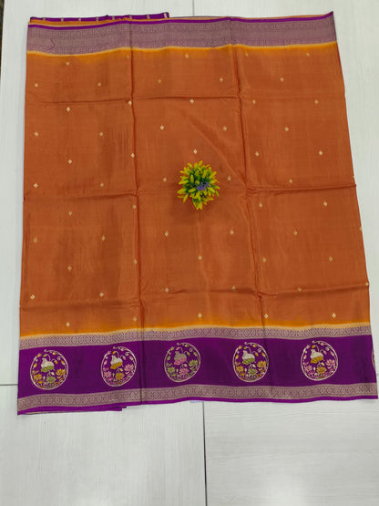 Mango silk designer saree in Rustie orange with contrast pichwai border and pallu and blouse