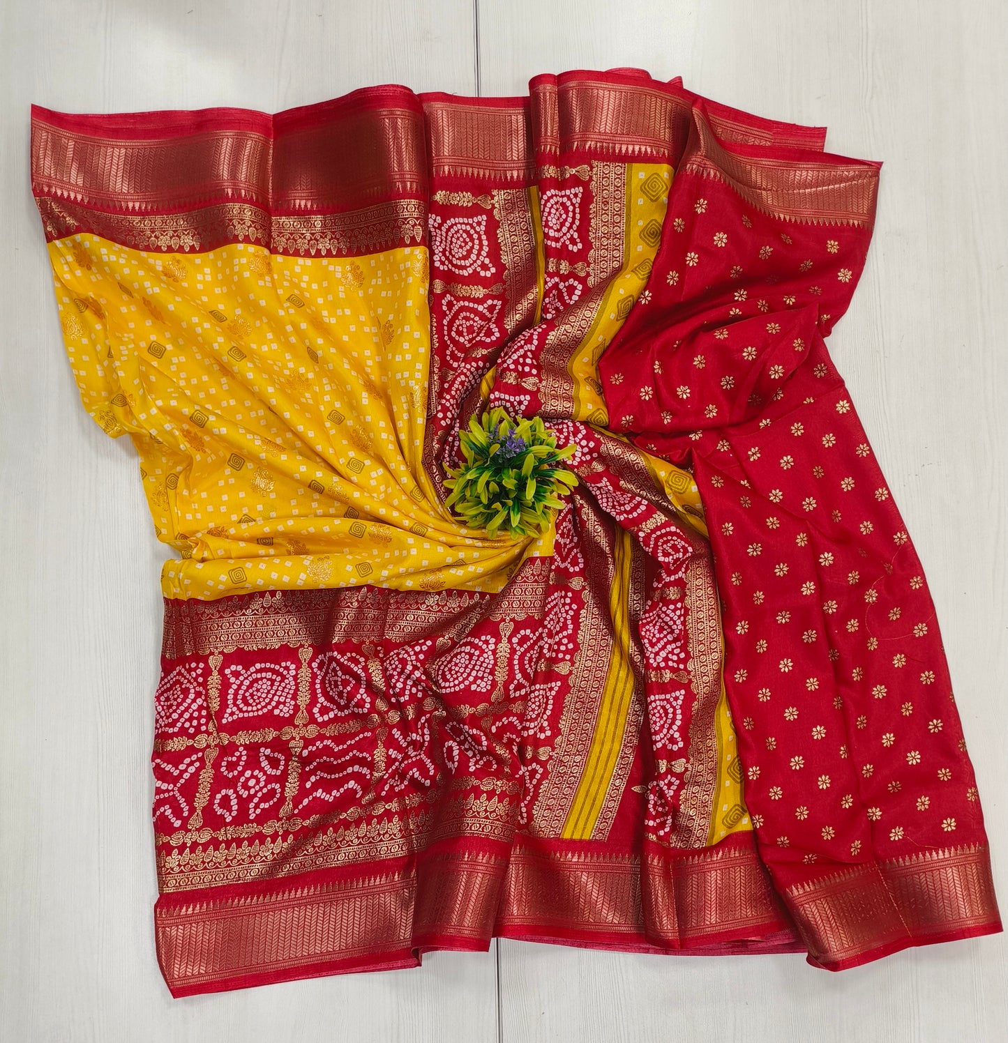 Yellow red Semi dola silk with bandhini print and foil print contrast border and rich pallu printed blouse with border